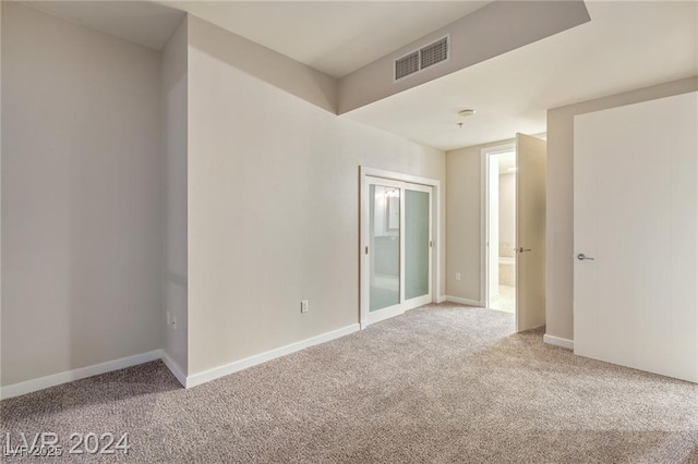 4575 Dean Martin Dr Unit 2701, Las Vegas, NV 89103 - carpeted empty room featuring baseboards