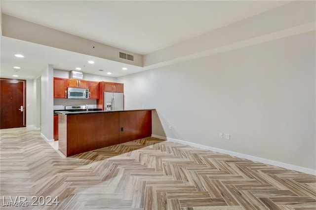 4575 Dean Martin Dr Unit 2701, Las Vegas, NV 89103 - kitchen with stainless steel microwave, fridge with ice dispenser, baseboards, dark countertops, and recessed lighting