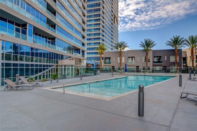 4575 Dean Martin Dr Unit 2701, Las Vegas, NV 89103 - community pool with fence and a patio area