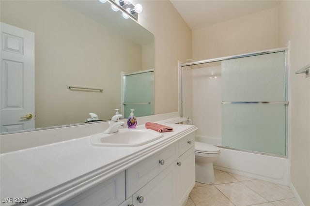 full bathroom with toilet, tile patterned flooring, vanity, and enclosed tub / shower combo