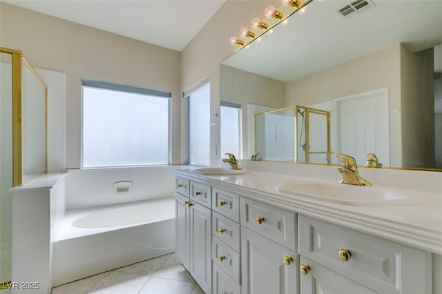 full bath with a shower stall, tile patterned floors, double vanity, and a bath