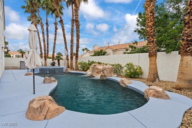 2024 Spruce Brook Dr, Henderson, NV 89074 - view of swimming pool featuring a fenced backyard, a patio area, and a pool with connected hot tub