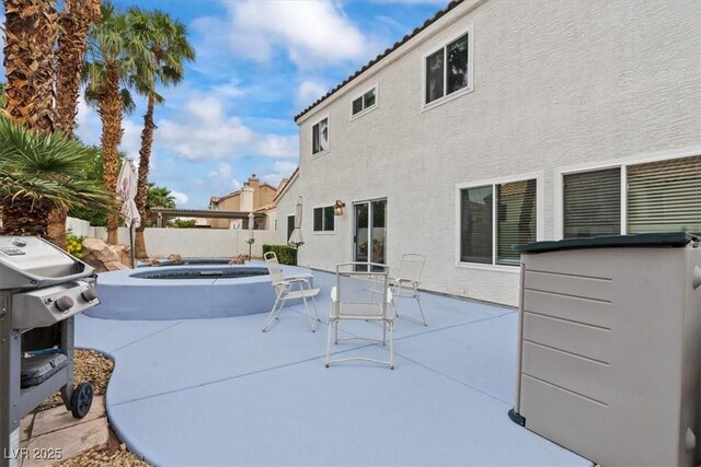 2024 Spruce Brook Dr, Henderson, NV 89074 - view of patio / terrace featuring area for grilling, fence, and an in-ground hot tub