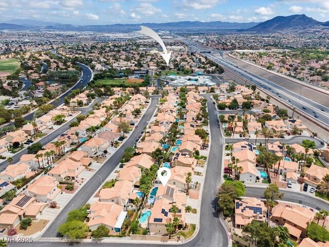 2024 Spruce Brook Dr, Henderson, NV 89074 - aerial view of property and surrounding area featuring a mountainous background and nearby suburban area
