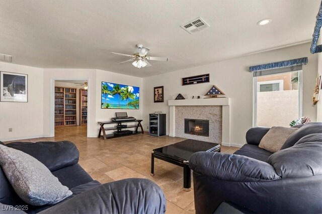 2024 Spruce Brook Dr, Henderson, NV 89074 - living area featuring ceiling fan, a glass covered fireplace, baseboards, and recessed lighting