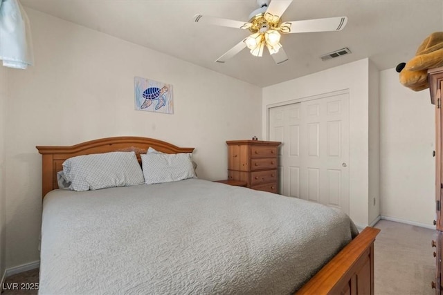 2024 Spruce Brook Dr, Henderson, NV 89074 - bedroom with light colored carpet, a closet, a ceiling fan, and baseboards