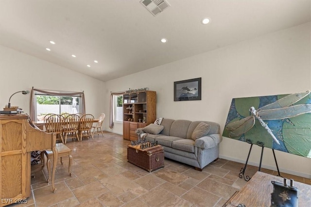 2024 Spruce Brook Dr, Henderson, NV 89074 - living room featuring recessed lighting, vaulted ceiling, stone tile floors, and baseboards