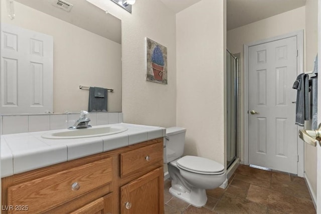 2024 Spruce Brook Dr, Henderson, NV 89074 - full bathroom with toilet, a shower stall, vanity, and stone finish flooring