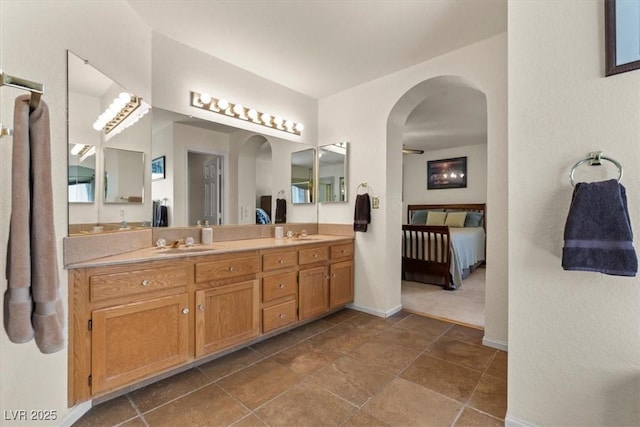 2024 Spruce Brook Dr, Henderson, NV 89074 - ensuite bathroom with double vanity and baseboards