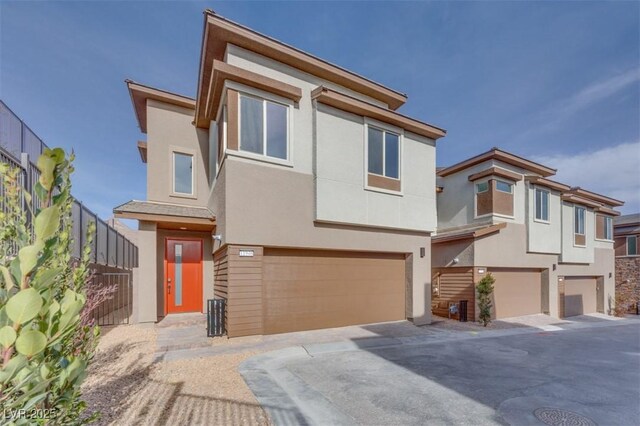 11946 Glide Reflection Ave, Las Vegas, NV 89138 - view of front of house with a garage, stucco siding, and driveway