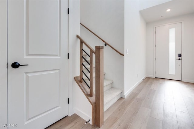 11946 Glide Reflection Ave, Las Vegas, NV 89138 - entryway featuring light wood finished floors, stairs, recessed lighting, and baseboards