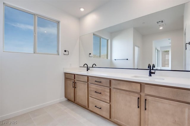 11946 Glide Reflection Ave, Las Vegas, NV 89138 - bathroom with plenty of natural light, double vanity, baseboards, tile patterned floors, and recessed lighting