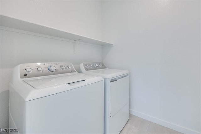 11946 Glide Reflection Ave, Las Vegas, NV 89138 - laundry area with separate washer and dryer, light tile patterned flooring, and baseboards