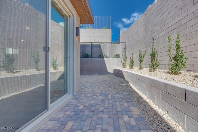 11946 Glide Reflection Ave, Las Vegas, NV 89138 - view of side of home featuring a fenced backyard and a patio
