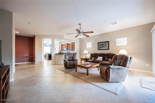 living area featuring a ceiling fan, light tile patterned flooring, baseboards, and recessed lighting
