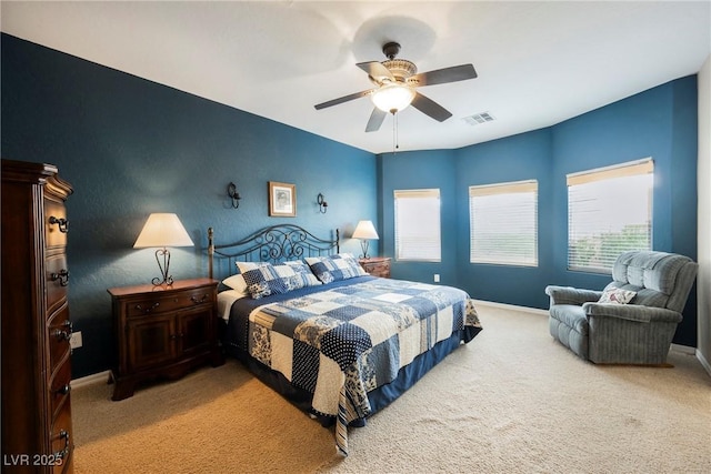 bedroom with baseboards, carpet, and a ceiling fan