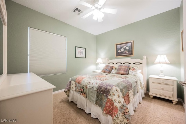 bedroom with light colored carpet, baseboards, and a ceiling fan