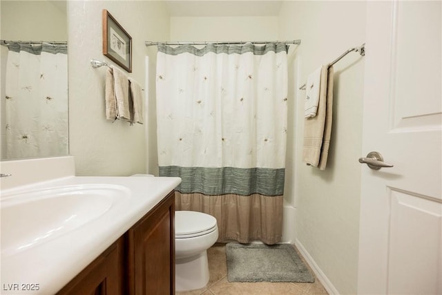 bathroom featuring toilet, vanity, and tile patterned floors