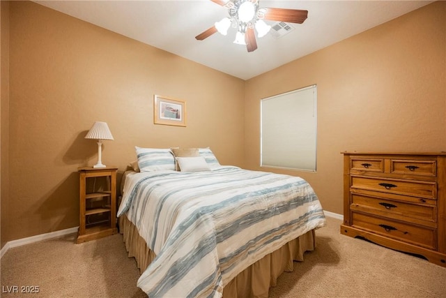 bedroom with light carpet, baseboards, and ceiling fan