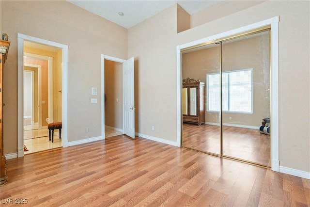 6224 Red Pine Ct, Las Vegas, NV 89130 - unfurnished bedroom with a closet, light wood finished floors, and baseboards
