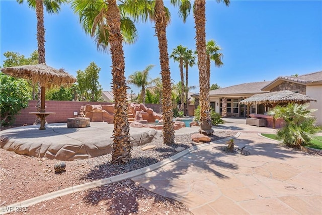 6224 Red Pine Ct, Las Vegas, NV 89130 - view of yard featuring a patio area and a fire pit