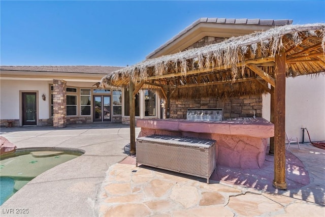 6224 Red Pine Ct, Las Vegas, NV 89130 - view of patio with french doors, an outdoor pool, and exterior kitchen