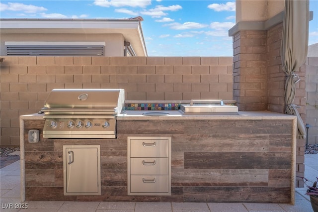 view of patio / terrace with a grill and exterior kitchen