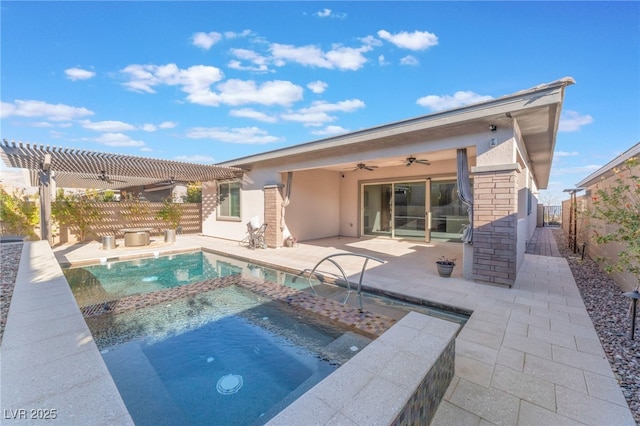 view of swimming pool featuring a ceiling fan, a pool with connected hot tub, a patio, and fence