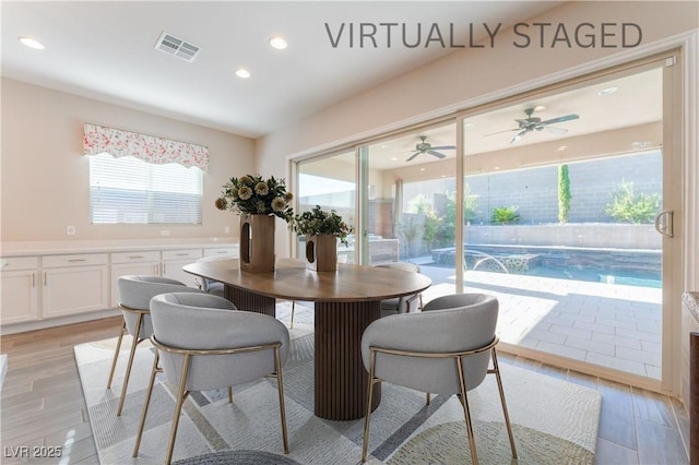 dining room featuring light wood-type flooring, recessed lighting, and ceiling fan