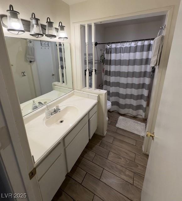 4820 Mahogany Dr, Las Vegas, NV 89110 - bathroom with toilet, vanity, and a shower with shower curtain