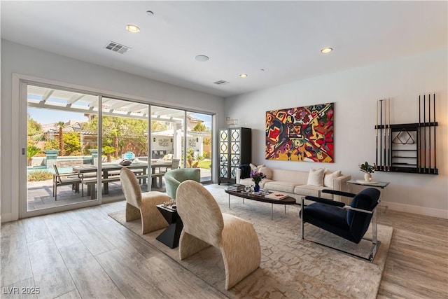 3458 W Agate Ave, Las Vegas, NV 89139 - living room featuring light wood finished floors, plenty of natural light, recessed lighting, and baseboards