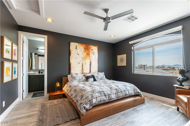 3458 W Agate Ave, Las Vegas, NV 89139 - bedroom featuring light wood-style floors, baseboards, recessed lighting, ensuite bath, and a ceiling fan