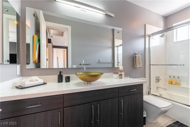 3458 W Agate Ave, Las Vegas, NV 89139 - bathroom featuring toilet, enclosed tub / shower combo, and vanity