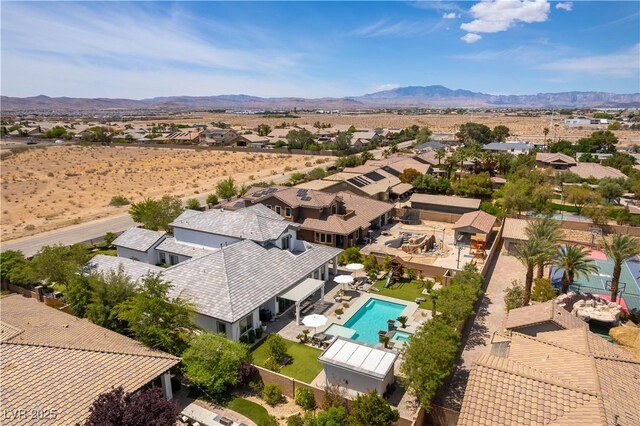 3458 W Agate Ave, Las Vegas, NV 89139 - aerial perspective of suburban area featuring a pool and a mountainous background