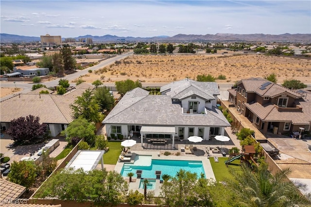 3458 W Agate Ave, Las Vegas, NV 89139 - aerial view of property and surrounding area with a pool and a mountainous background