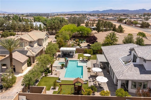 3458 W Agate Ave, Las Vegas, NV 89139 - aerial view of residential area with a pool area and a mountainous background