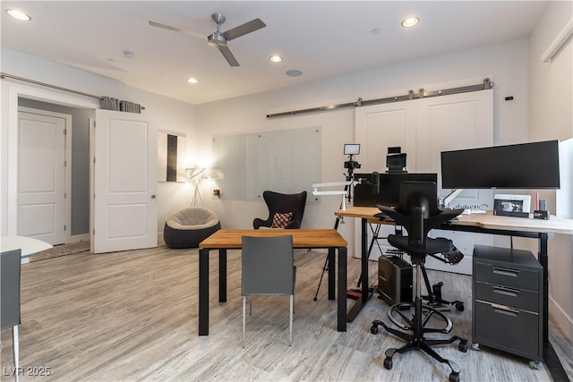 3458 W Agate Ave, Las Vegas, NV 89139 - home office with ceiling fan, a barn door, wood finished floors, recessed lighting, and baseboards