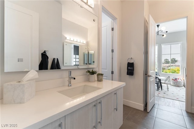 3458 W Agate Ave, Las Vegas, NV 89139 - bathroom featuring vanity, baseboards, and tile patterned floors