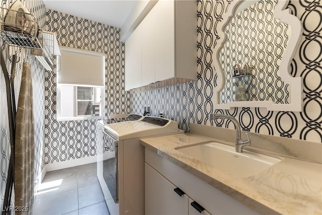 3458 W Agate Ave, Las Vegas, NV 89139 - washroom featuring washer / clothes dryer, wallpapered walls, cabinet space, and tile patterned flooring