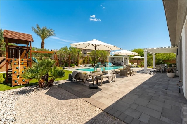 3458 W Agate Ave, Las Vegas, NV 89139 - view of patio / terrace with a pergola, a playground, and a fenced backyard