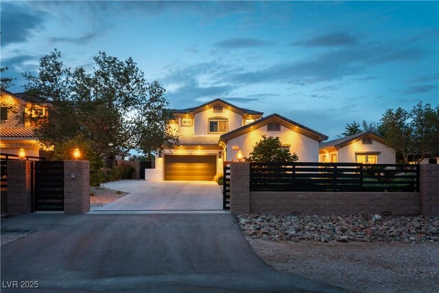 3458 W Agate Ave, Las Vegas, NV 89139 - view of front facade featuring a fenced front yard, concrete driveway, a garage, stucco siding, and a gate