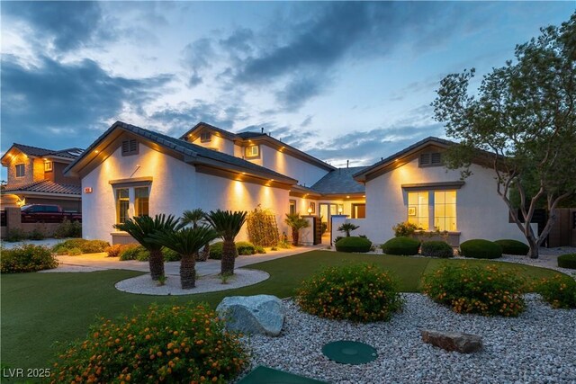 3458 W Agate Ave, Las Vegas, NV 89139 - view of front facade featuring stucco siding and a front yard