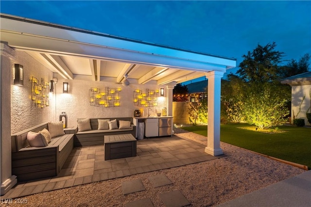 3458 W Agate Ave, Las Vegas, NV 89139 - patio at night with an outdoor hangout area and a sink