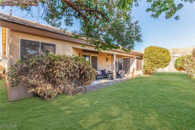 286 Fairmeadow St, Henderson, NV 89012 - back of property with a lawn, a patio area, ceiling fan, and stucco siding