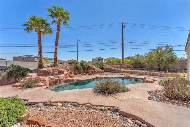 view of swimming pool featuring a fenced backyard