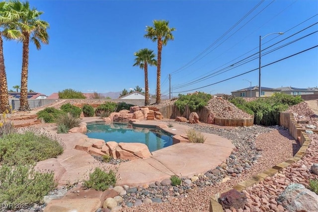 view of pool featuring a fenced backyard and a patio