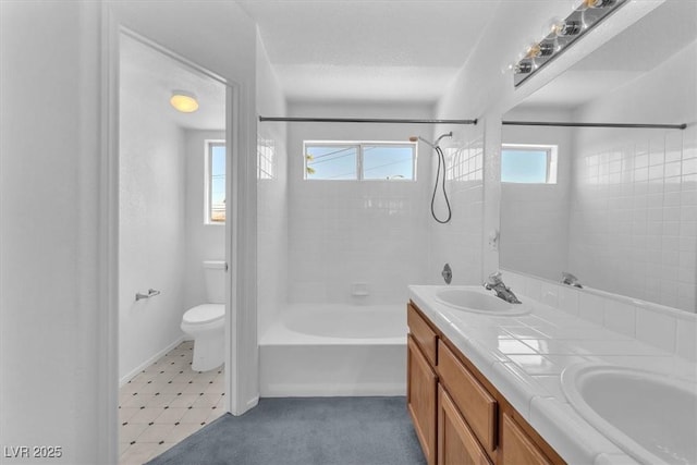 full bath with toilet, double vanity, and tub / shower combination