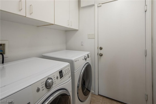10336 Birch Bluff Ln, Las Vegas, NV 89145 - laundry room with cabinet space, washer and clothes dryer, and light tile patterned flooring