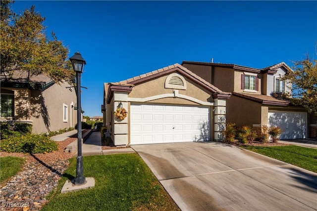 10336 Birch Bluff Ln, Las Vegas, NV 89145 - view of front of house with stucco siding, driveway, and a tile roof