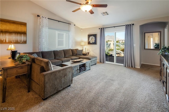 10336 Birch Bluff Ln, Las Vegas, NV 89145 - carpeted living room with ceiling fan, vaulted ceiling, arched walkways, and baseboards
